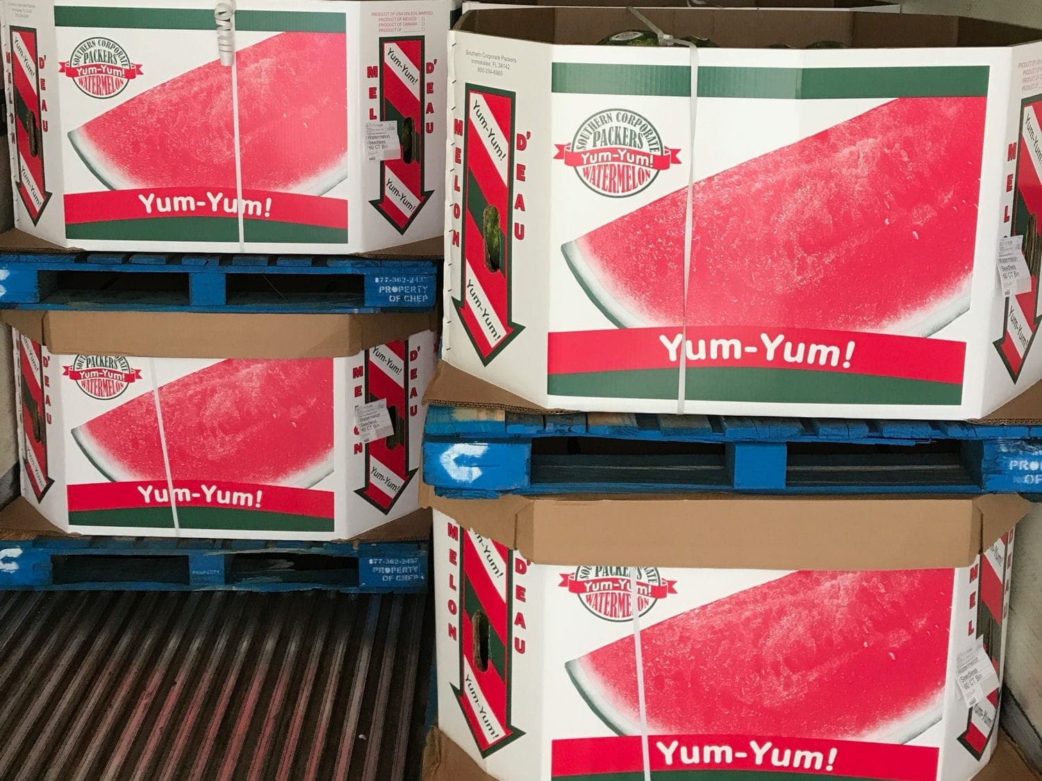 Yum Yum watermelon bins loaded on pallets inside a trailer
