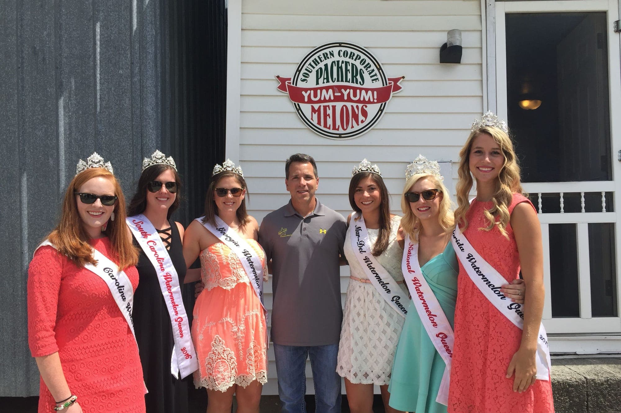 Brian Arrigo with the national and state watermelon queens at the Yum Yum Melons house